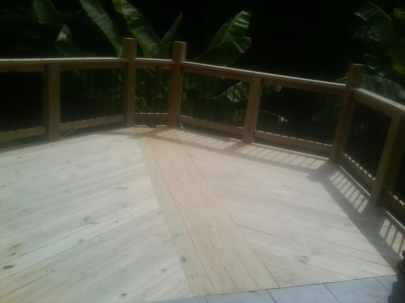 New wood deck and railing built off the back of a home in Yorktown